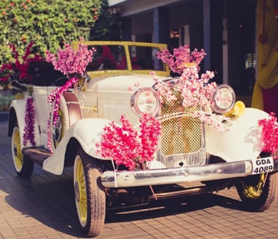 Team members smiling and greeting a client